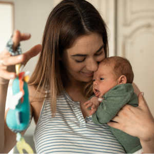 mother playing with newborn child during lactation consult on zoom